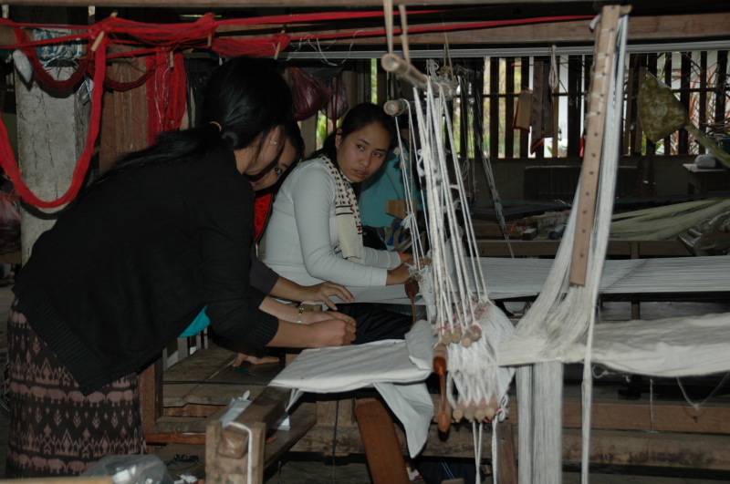 Artisans from Phontong are weaving silk scarves for Counting Flowers