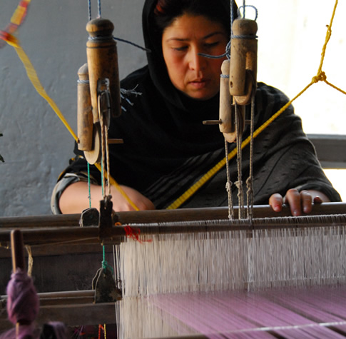 Azezana - artisan is weaving silk scarves