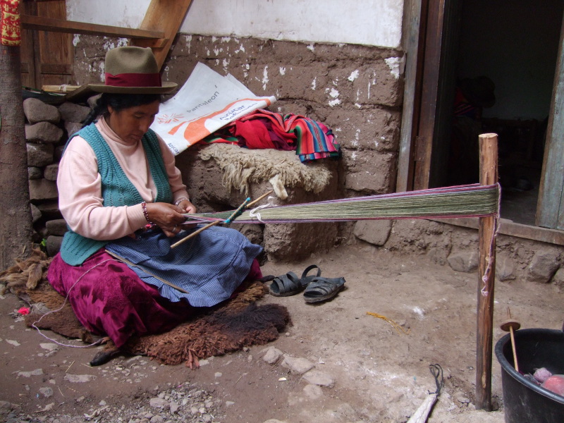 Hilaria is weaving an alpaca scarf