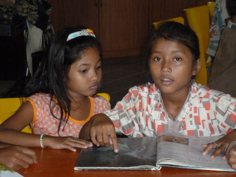 Young orphans learn how to read