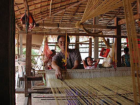 Artisan from Panmai cooperative is weaving a silk scarf