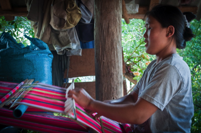Pwo Karen artisan is weaving a cotton sarong